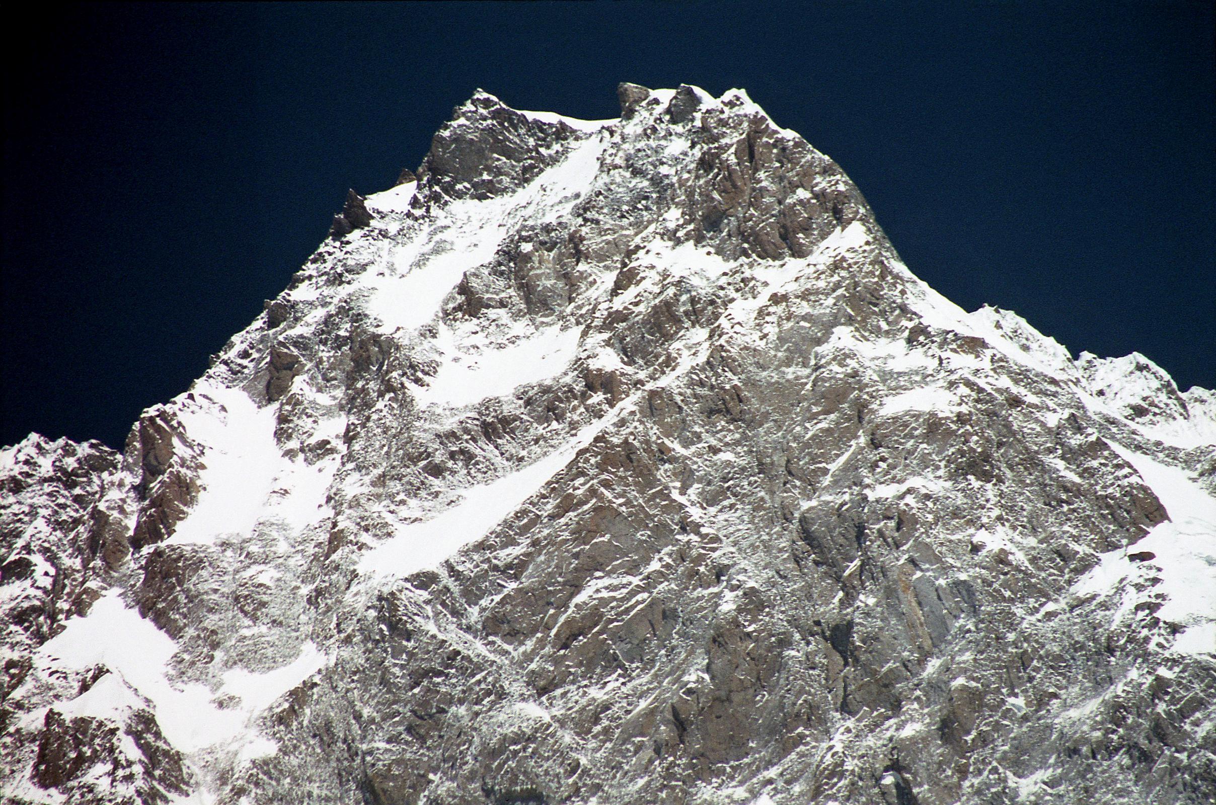 17 Nanga Parbat Rupal Face Summit Area Close Up From Rupal Face Base Camp Nanga Parbat Rupal Face Summit Area Close Up From Herligkoffer Rupal Face Base Camp. My first impression on emerging onto the ridge from the South Face was for me the most powerful moment of the entire Nanga Parbat Expedition. Everything seemed so unreal, so quiet. And there was Gunther, right next to me. (The Naked Mountain by Reinhold Messner).